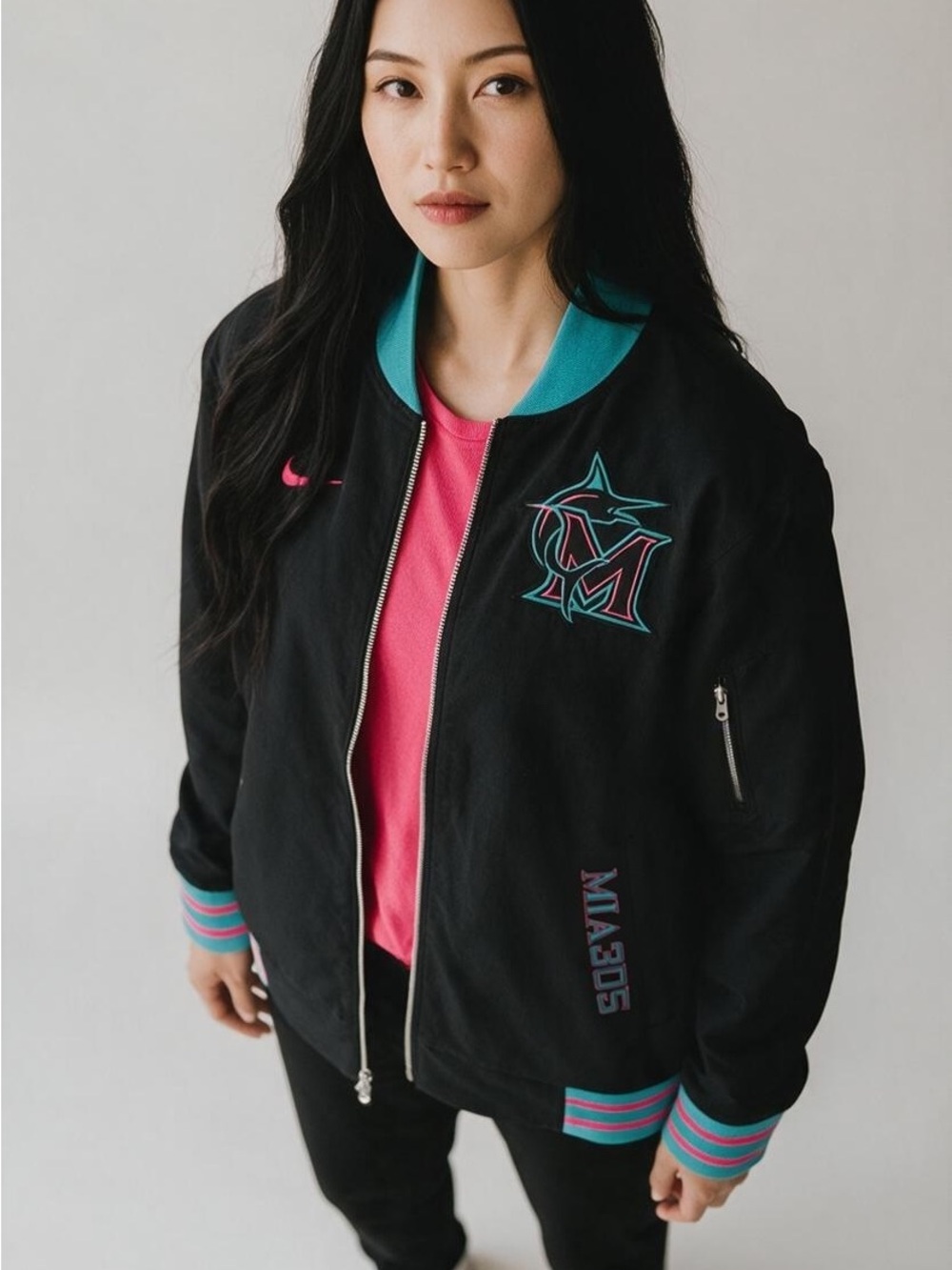 Nike Women’s Black Bomber Jacket with Teal & Pink Trim